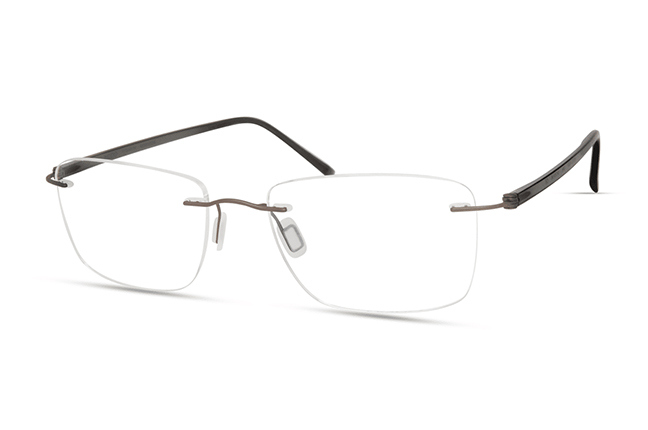 Il modello “4602P” (nella colorazione “SMOKE”) degli occhiali Modo, appartenente alla collezione “PAPER-THIN RIMLESS”