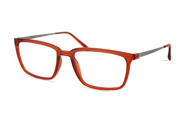 Il modello “7064” (nella colorazione “ORANGE”) degli occhiali Modo, appartenente alla collezione “R 1000 + TITANIUM”